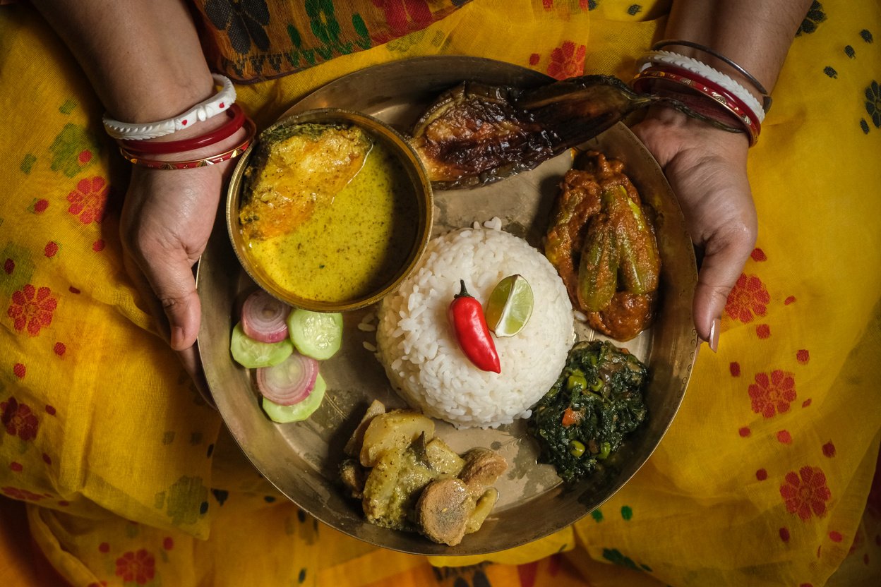 Woman Serving Homecooked Dishes